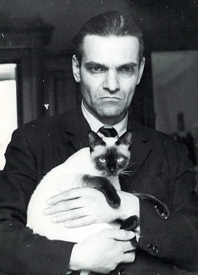 Soviet linguist Yuri Knorozov holding his Siamese cat Asya